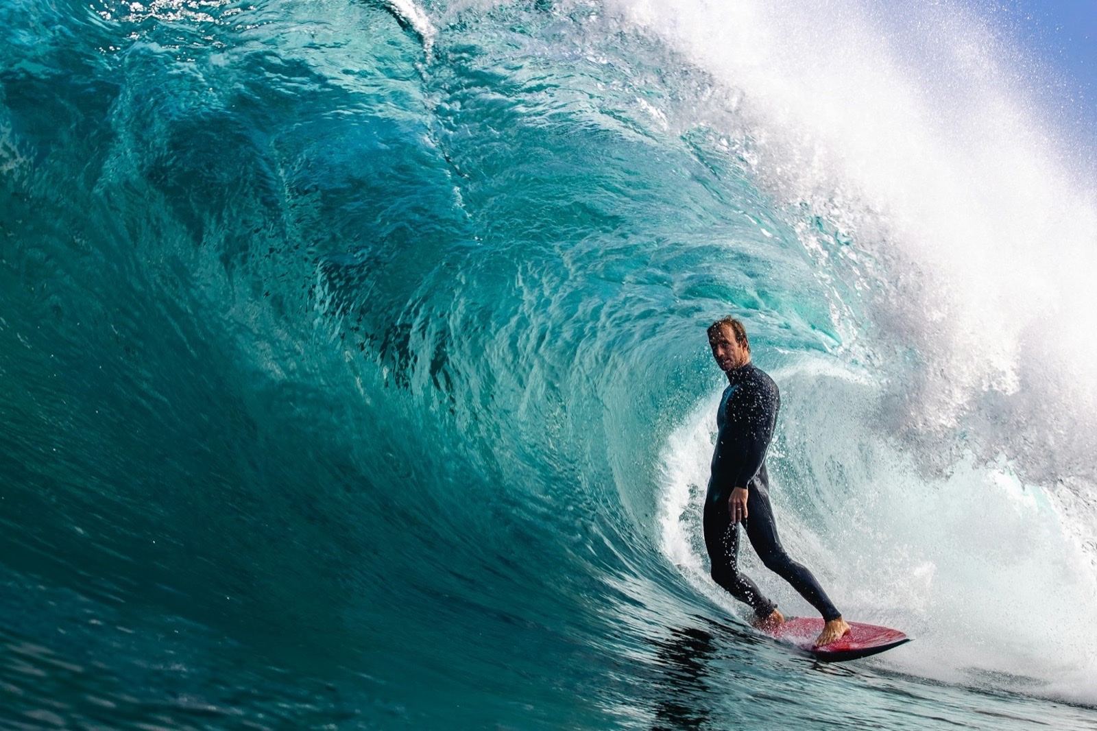 A surfer inside a barrel